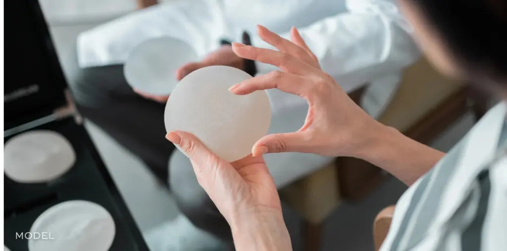 Doctor holding implant