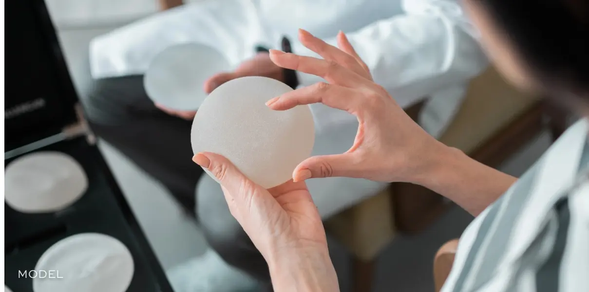 Doctor holding implant