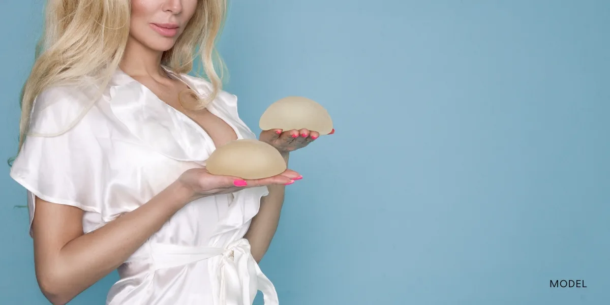 Women holding implants